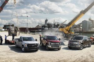 three 2018 Ford Super Duty models parked at a construction site