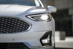close up of the front of a white 2019 Ford Fusion with an all-new chrome mesh grille