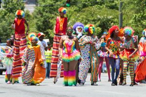 people wearing colorful clown outfits during the 2016 Atlanta Caribbean Carnival