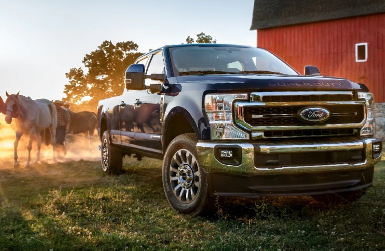 2021 Ford Super Duty in Antimatter Blue on farm land