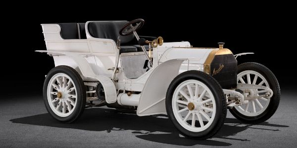 White 1903 Mercedes-Simplex 40 PS on Black Background