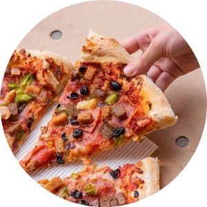 Close Up of a Hand Taking a Piece of Pizza