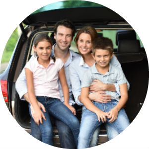 Family Sitting on the Tailgate of a Car