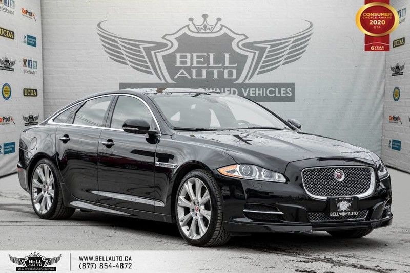 Exterior view of a black 2015 Jaguar XJ in the Bell Auto Inc showroom