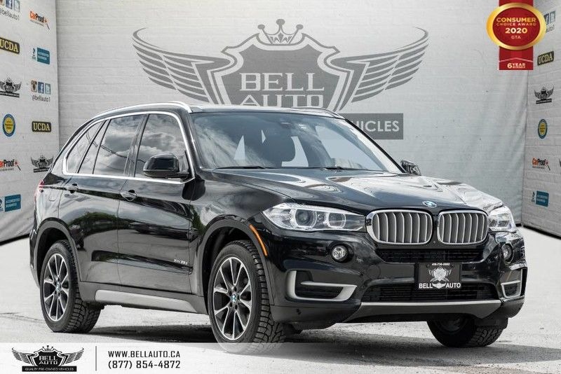 Exterior view of pre-owned luxury vehicles a black 2016 BMW X5 xDrive35 in the Bell Auto Inc showroom