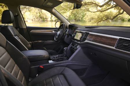 side view of front interior of 2018 volkswagen atlas including seats and center console