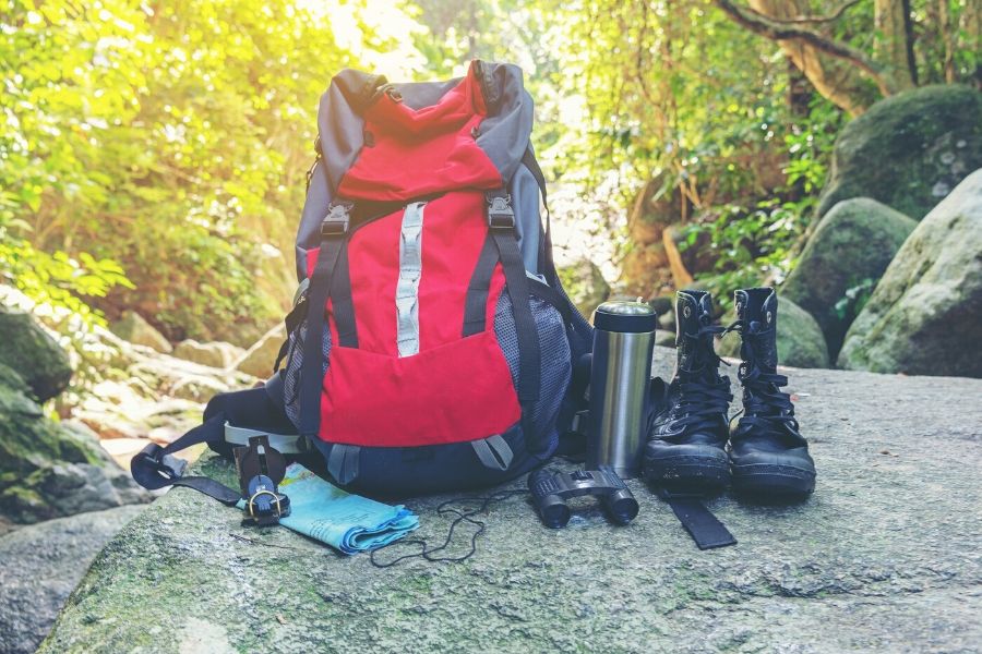 Backpack and gear on rock