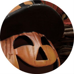 Close Up of a Jack-O-Lantern Wearing a Witch Hat