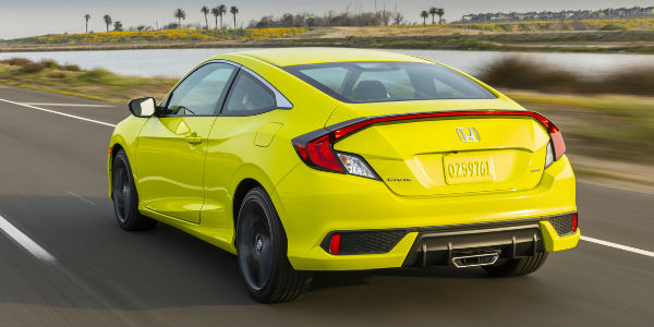 Neon Yellow 2020 Honda Civic Coupe Rear Exterior on Highway