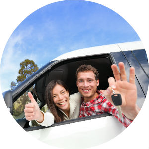 Happy Couple in a New Car Holding Keys