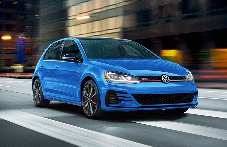 The front view of a blue 2021 Volkswagen Golf GTI.