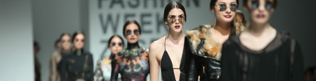 Sunglasses clad models walking the runway