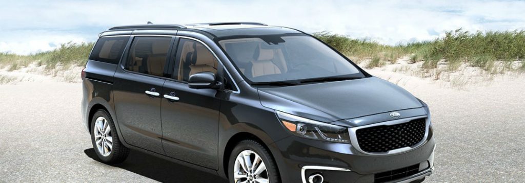 2018 Kia Sedona Family-Friendly Features with image of the Sedona parked at a beach