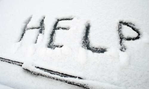 Help written through snow on a snow covered windshield