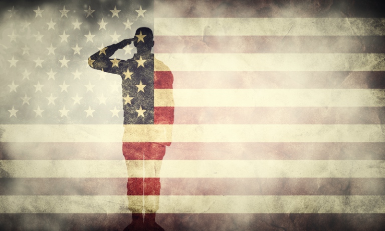 double exposure of a soldier and an American flag