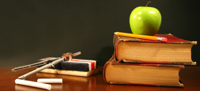 school books an apple and a blackboard
