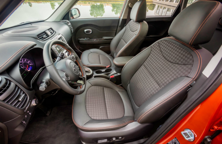 front seats of red kia soul