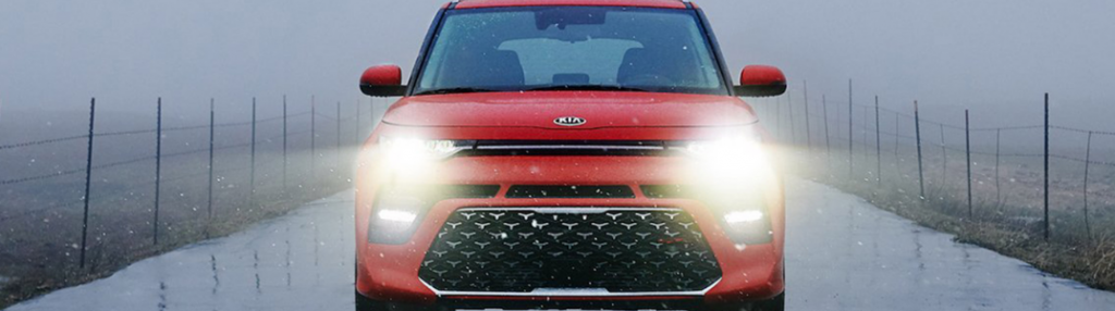 2020 Kia Soul driving down a foggy road red exterior Dayton OH