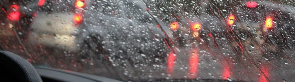 Close-up of a wet windshield during a storm