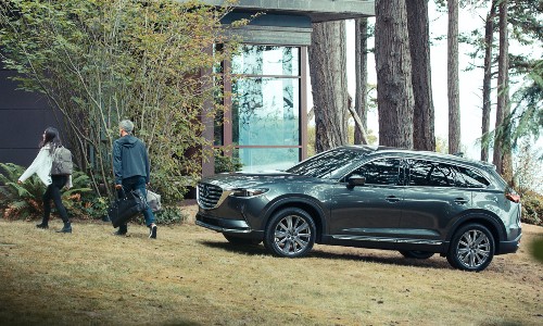 2021 Mazda CX-9 parked on grass outside forest home
