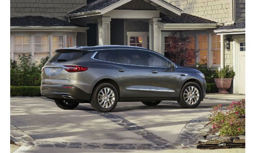 2018 Buick Enclave gray sideways in front of family home