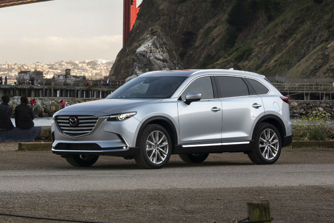 Driver's side exterior view of a gray 2018 Mazda CX-9