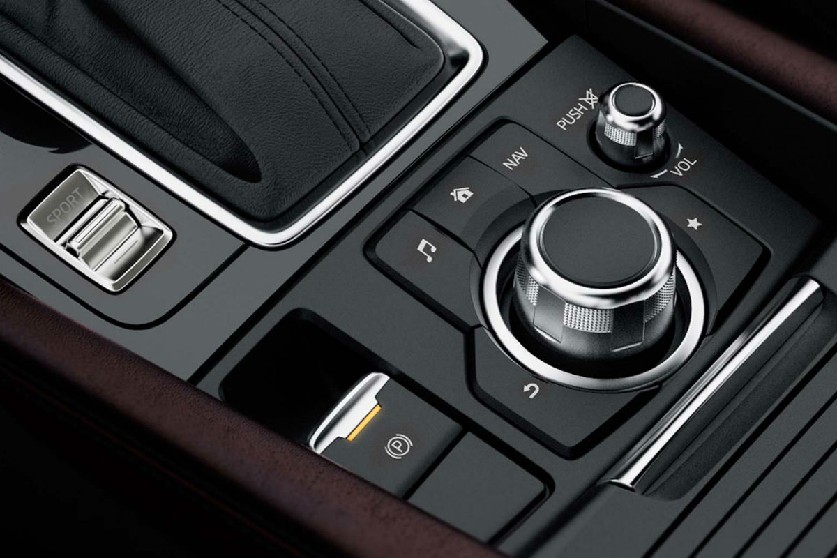 Push Button parking brake of the 2018 Mazda3