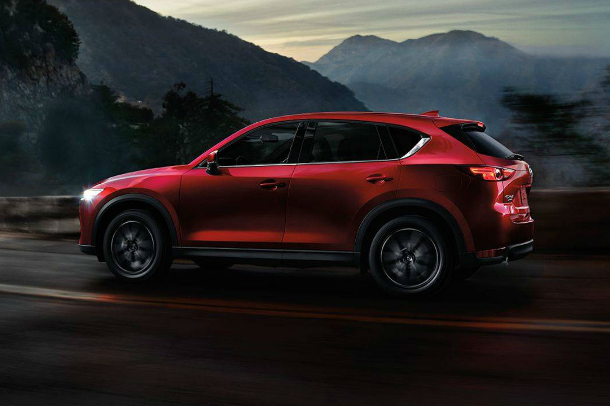 Driver's side exterior view of a red 2018 Mazda CX-5