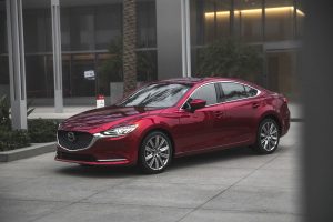 Driver side exterior view of a red 2018 Mazda6