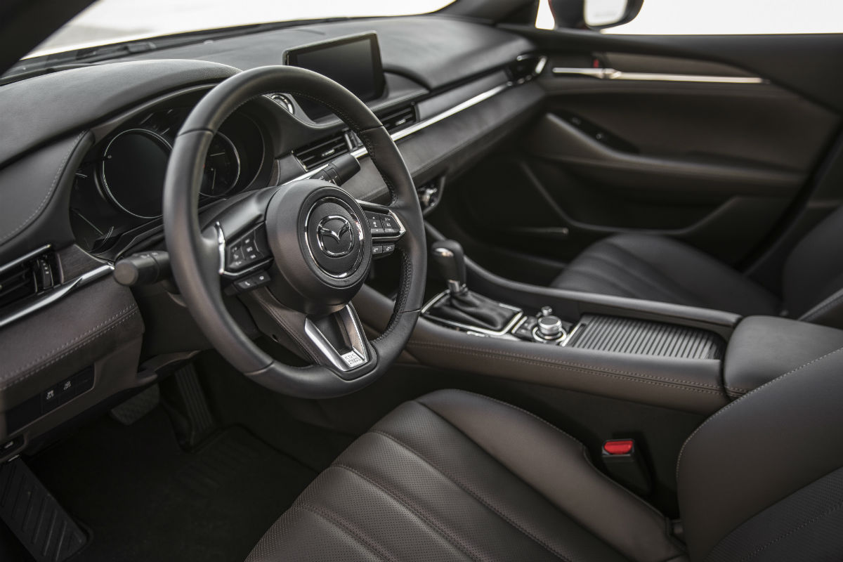 Side view of the driver's cockpit and center console of the 2018 Mazda6