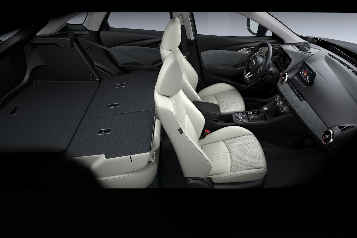 Side view of the rear seat folded flat inside the 2019 Mazda CX-3