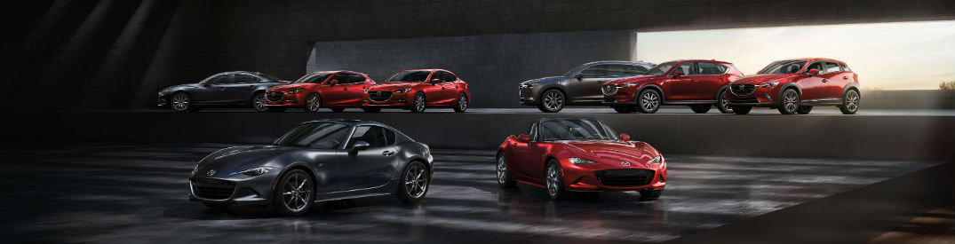 The 2018 Mazda vehicle lineup parked next to one another 