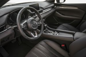 Steering wheel controls and center console of the 2018 Mazda6