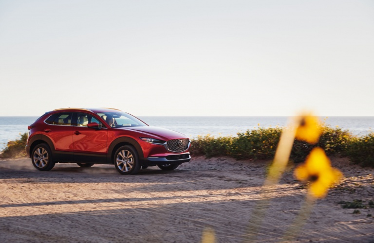 2021 Mazda CX-30 red side view at the beach