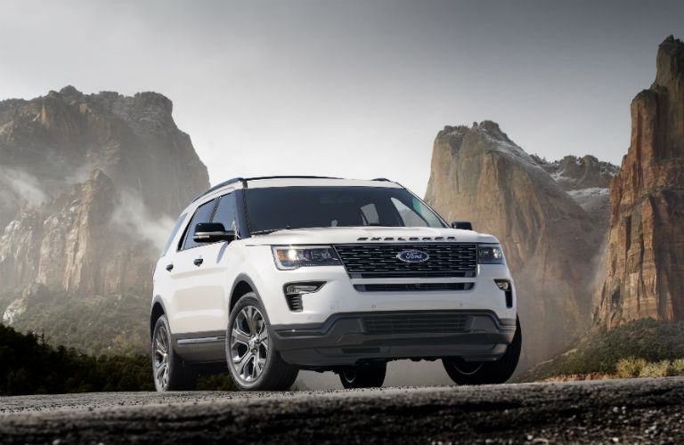White 2018 Ford Explorer parked in front of mountainous landscape