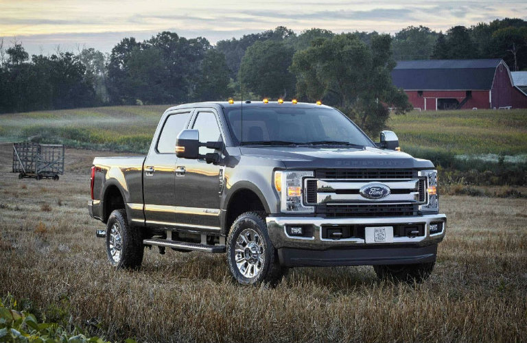 2018 Ford Super Duty XLT parked in field with barn in background